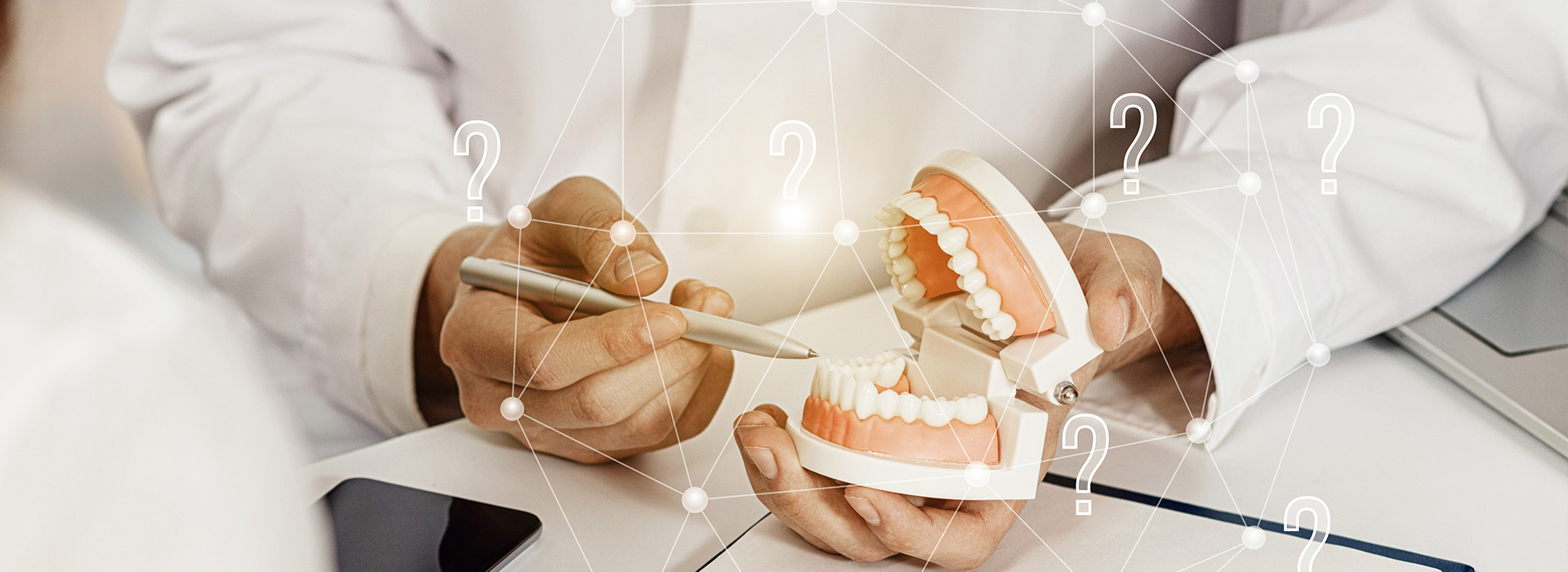 The image depicts a person holding a toothbrush with a magnified view of their teeth, set against a blurred background featuring a clock and a question mark.