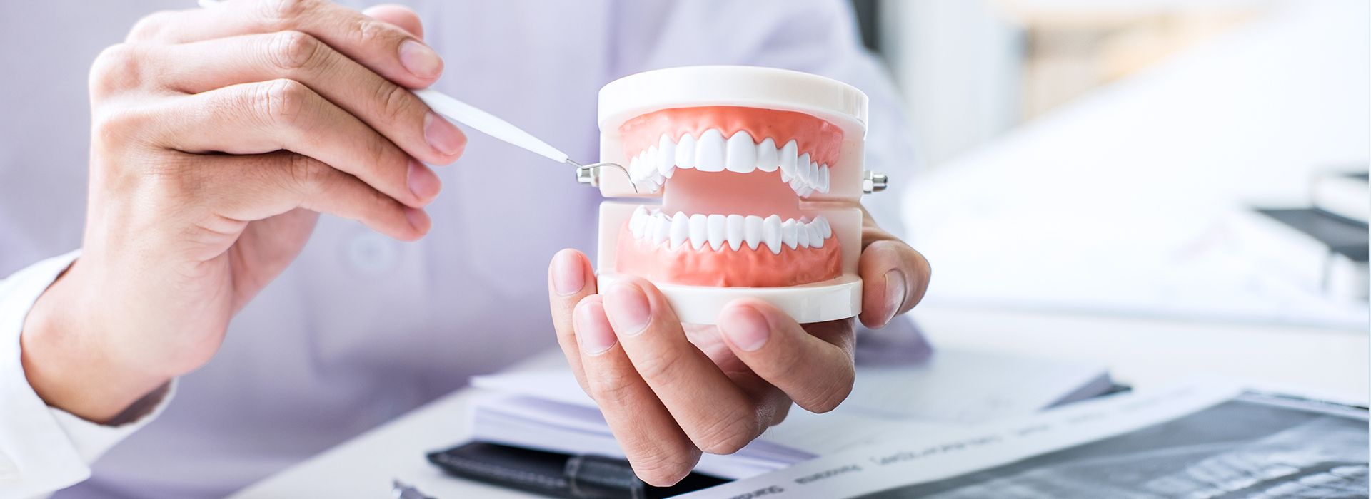 The image shows two different views of a person holding a toothbrush with toothpaste while sitting at a desk, with a focus on dental hygiene.